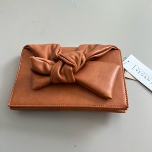 NWT VEGAN LEATHER BOW CLUTCH